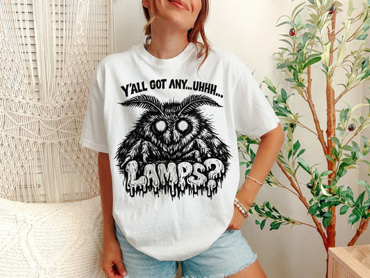 A White Unisex Garment-Dyed T-shirt mockup (front view) showing the yall got any lamps shirt - funny moth meme t-shirt print on the front. The artwork highlights meme gift, yall got any lamps shirt - funny moth meme t-shirt, unisex garment-dyed t-shirt, white, yall, got, any, lamps, shirt, -, describing the graphic and theme on the garment.