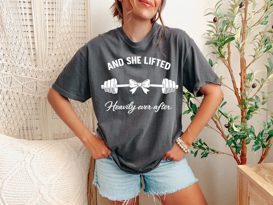 Person wearing a gray t-shirt with a humorous fitness graphic and text.