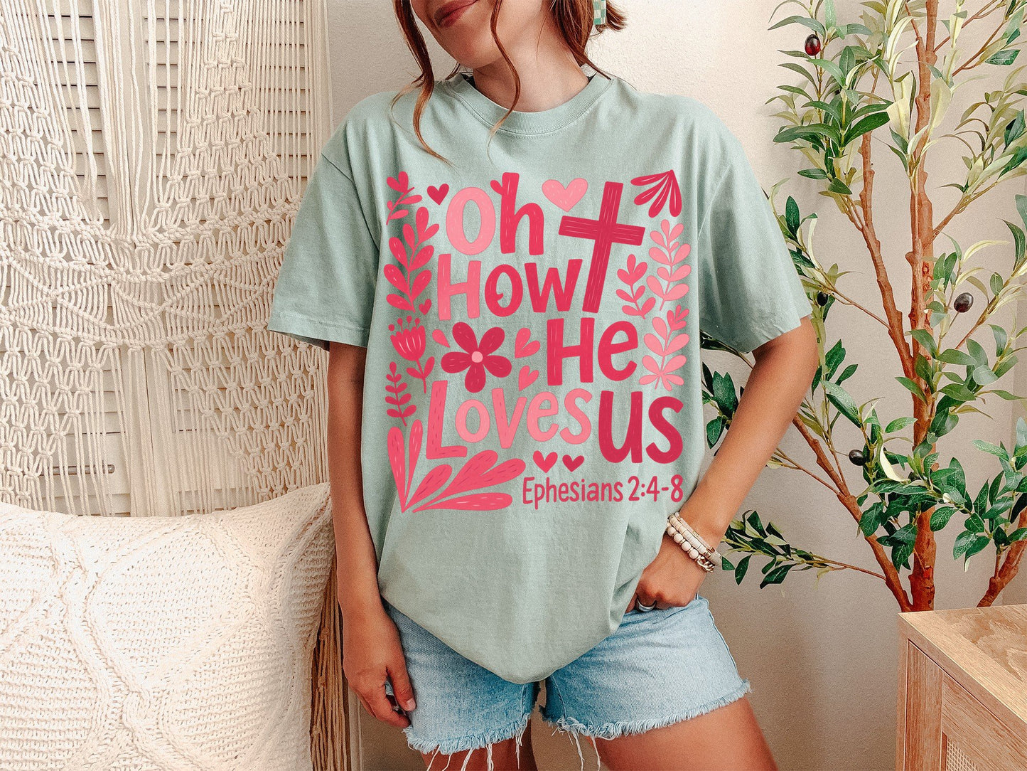 A Bay Unisex Garment-Dyed T-shirt mockup (front view) showing the oh how he loves us christian shirt jesus loves us graphic tee print on the front. The artwork highlights jesus, graphic, tee, unisex, garment-dyed, t-shirt, christian shirt, oh how he loves us, worship lyrics tee, faith based gift, describing the graphic and theme on the garment.