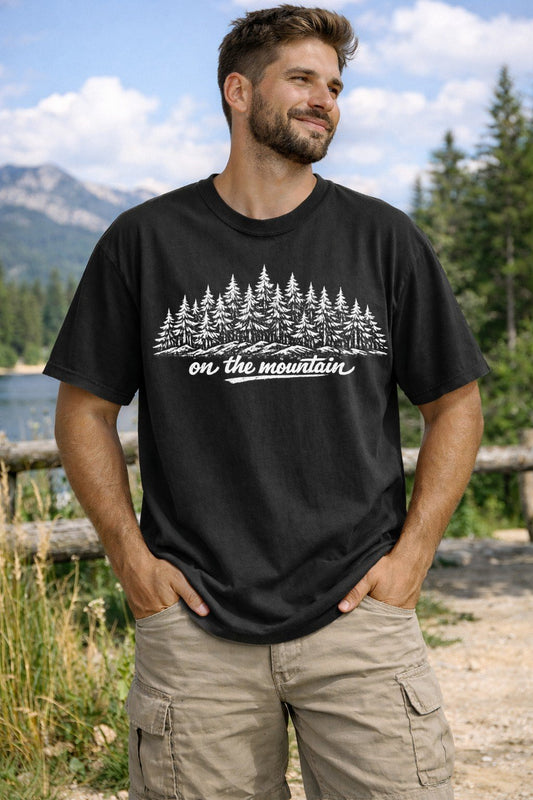 A Black Unisex Garment-Dyed T-shirt mockup (front view) showing the granola girl hiking shirt - minimalist mountain graphic print on the front. The artwork highlights vintage hiking, granola girl hiking shirt - minimalist mountain graphic, unisex garment-dyed t-shirt, black, granola, girl, hiking, shirt, -, minimalist, describing the graphic and theme on the garment.
