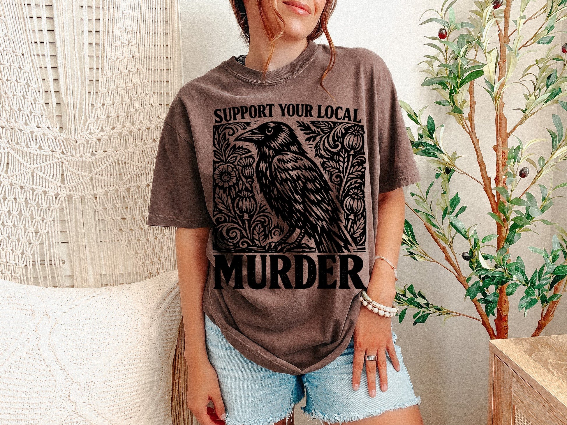 A Espresso Unisex Garment-Dyed T-shirt mockup (front view) showing the support your local murder crow shirt - funny bird lover gift tee print on the front. The artwork highlights raven shirt, vintage crow shirt, nature lover gift, crows before bros, support your local murder crow shirt - funny bird lover gift tee, unisex garment-dyed t-shirt, espresso, support, your, local, describing the graphic and theme on the garment.