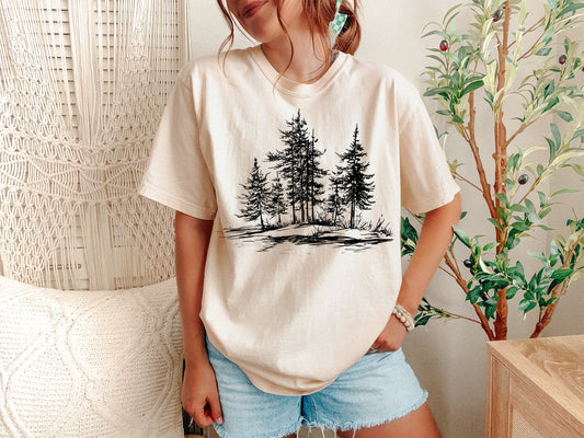 A Ivory Unisex Garment-Dyed T-shirt mockup (front view) showing the vintage pine tree t-shirt retro camping shirt outdoor adventure apparel print on the front. The artwork highlights nature lover gift, camping shirt, minimalist tree, vintage nature, hiking apparel, granola girl, gorpcore, outdoor adventure, christmas tree shirt, botanical shirt, describing the graphic and theme on the garment.