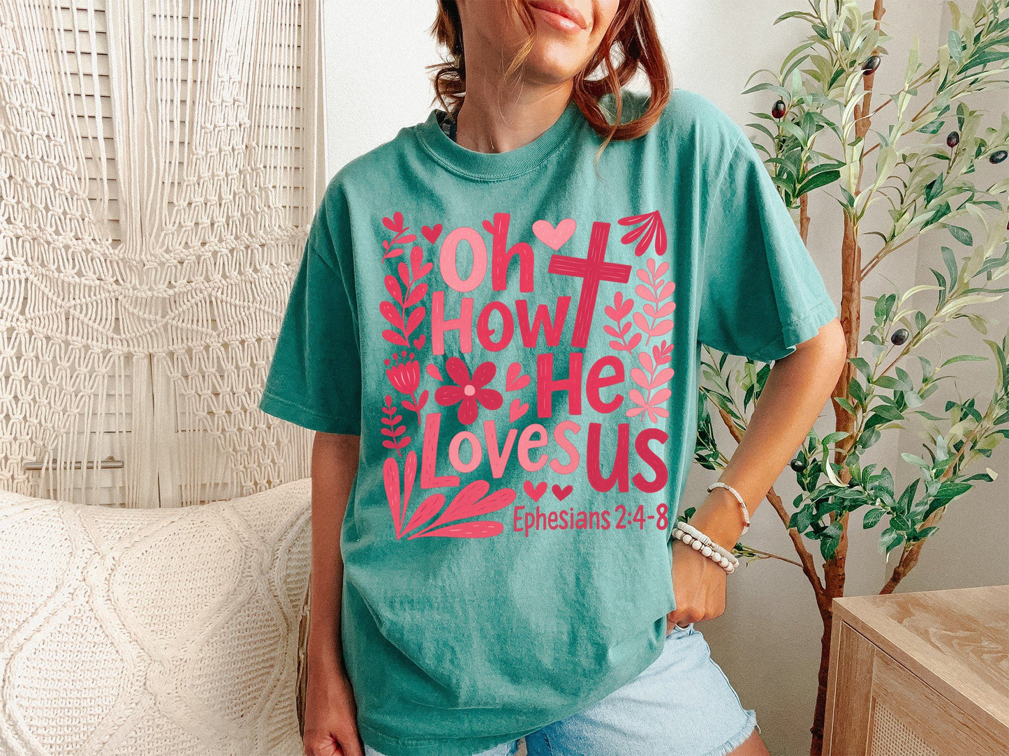 A Light Green Unisex Garment-Dyed T-shirt mockup (front view) showing the oh how he loves us christian shirt jesus loves us graphic tee print on the front. The artwork highlights graphic, tee, unisex, garment-dyed, t-shirt, christian shirt, oh how he loves us, worship lyrics tee, faith based gift, jesus loves us, describing the graphic and theme on the garment.