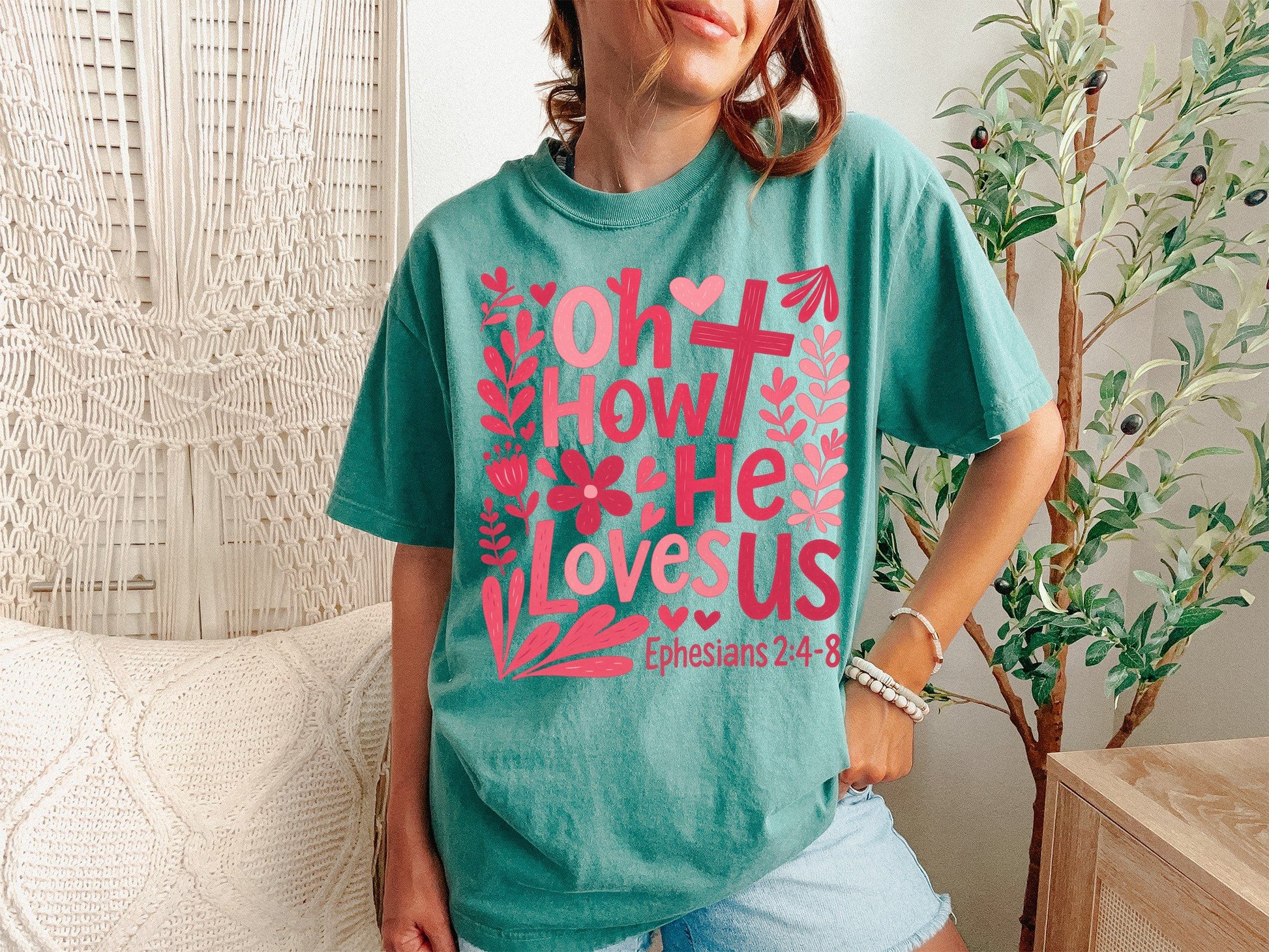 A Light Green Unisex Garment-Dyed T-shirt mockup (front view) showing the oh how he loves us christian shirt jesus loves us graphic tee print on the front. The artwork highlights graphic, tee, unisex, garment-dyed, t-shirt, christian shirt, oh how he loves us, worship lyrics tee, faith based gift, jesus loves us, describing the graphic and theme on the garment.
