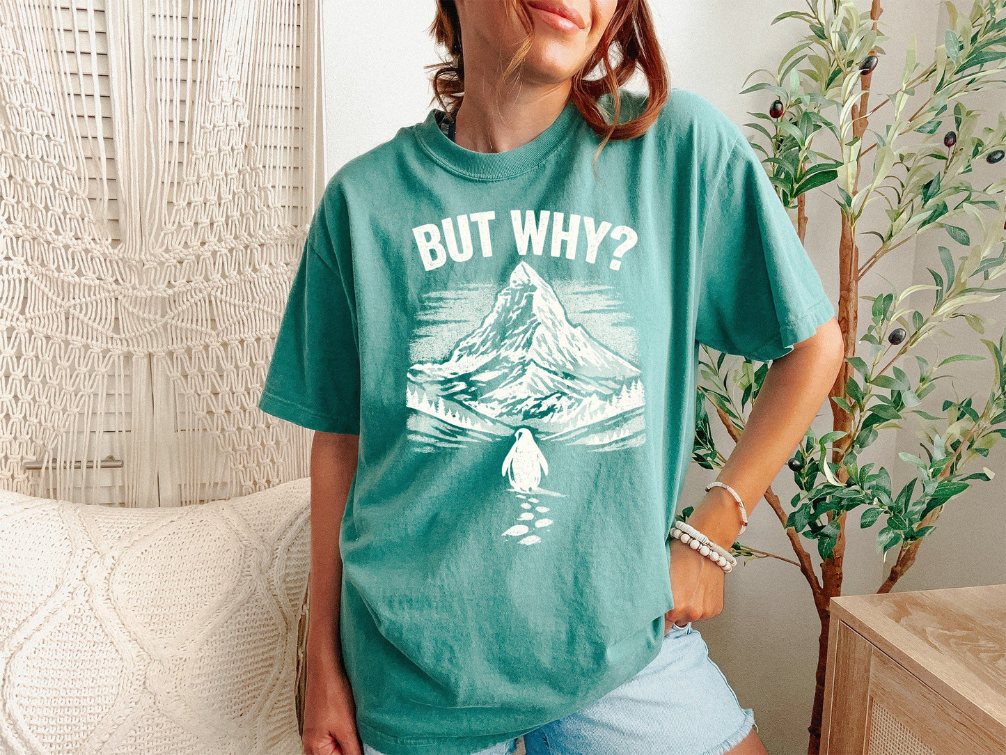 A Light Green Unisex Garment-Dyed T-shirt mockup (front view) showing the but why be the damn penguin shirt - sarcastic existential top print on the front. The artwork highlights sarcastic t-shirt, but why be the damn penguin shirt - sarcastic existential top, unisex garment-dyed t-shirt, light green, but, why, be, the, damn, penguin, describing the graphic and theme on the garment.