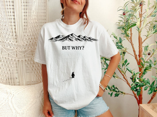 A White Unisex Garment-Dyed T-shirt mockup (front view) showing the funny depressed penguin meme tee - lone penguin mountain journey print on the front. The artwork highlights sarcastic t-shirt, funny depressed penguin meme tee - lone penguin mountain journey, unisex garment-dyed t-shirt, white, funny, depressed, penguin, meme, tee, -, describing the graphic and theme on the garment.